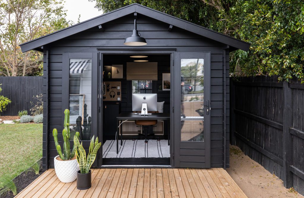 A black kitset cabins used as a home office studio