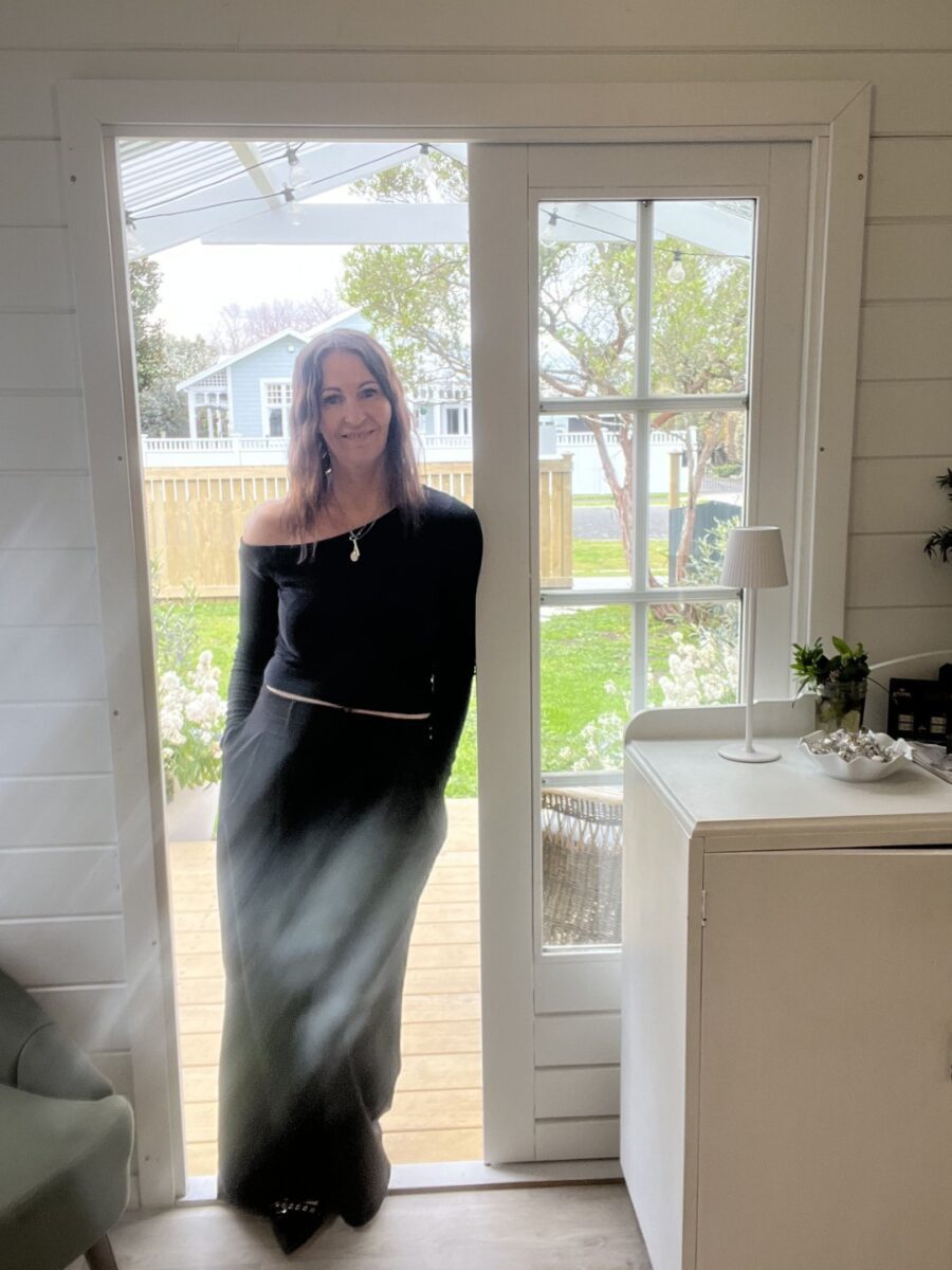 Belinda standing in the door of her Cabana Cabin Hair Salon