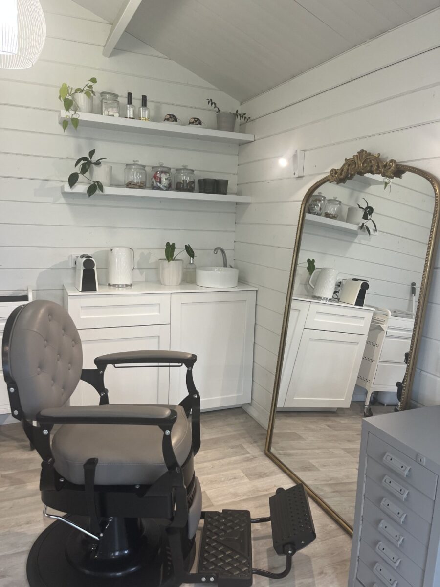 Belinda's Cabana Cabin Kitset as a home hair salon with a full barbershop chair.