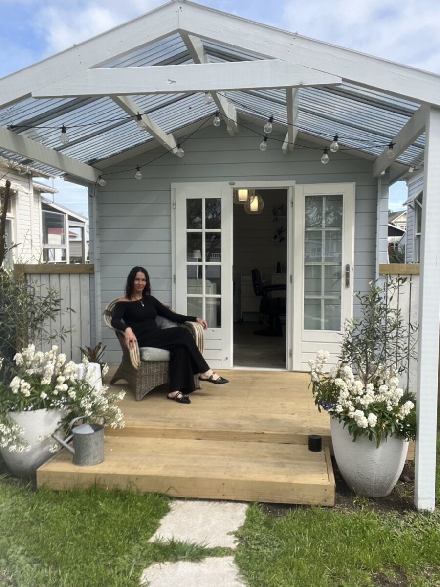 Belinda sitting outside her Cabana Cabin Hair Salon